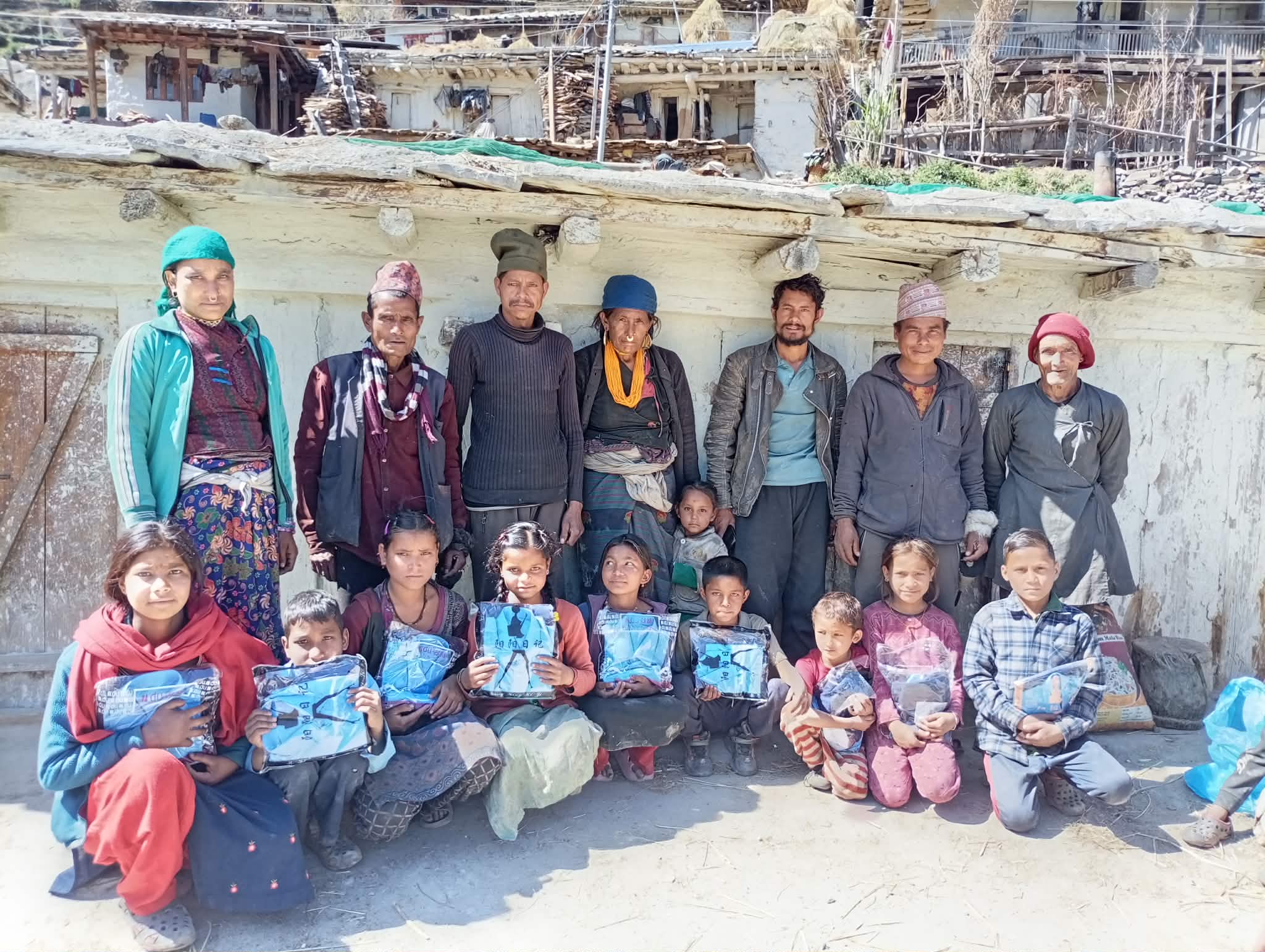 Students in Ripa Village, Sarkegad-2, Humla holding newly distributed school uniforms provided by Pragati Path Educational Foundation, February 2026.